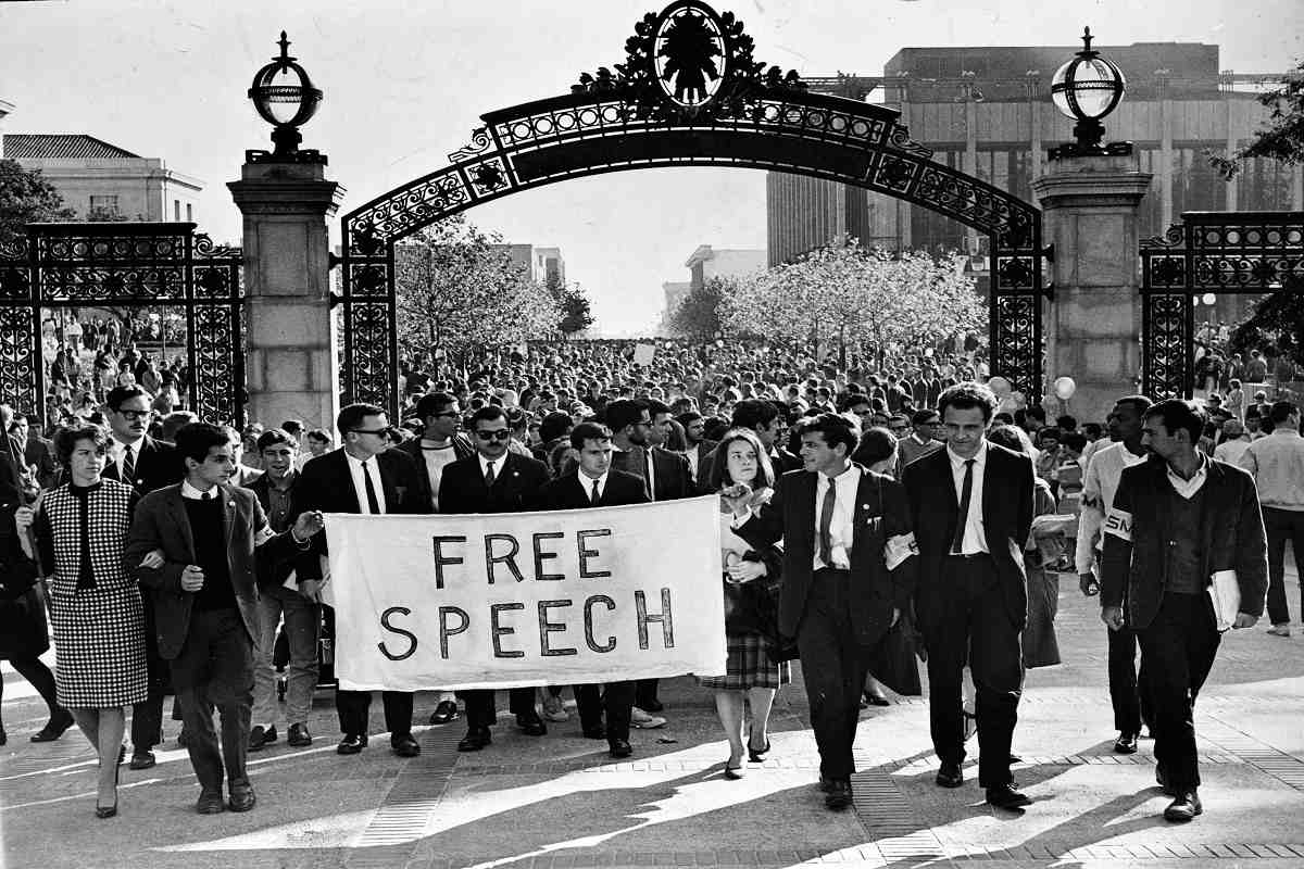 Counter culture movement in the 1960s. Students holding a sign calling for Free Speech