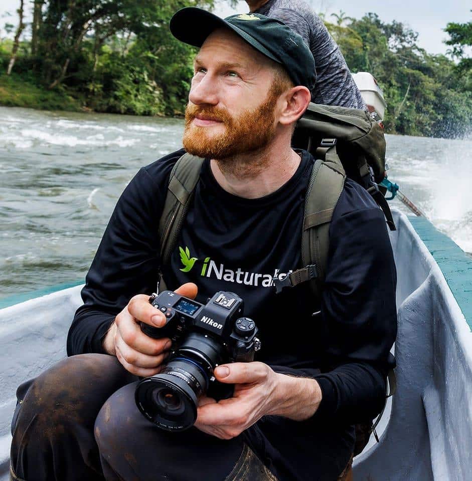 Alan Rockefeller in a boat on a expedition